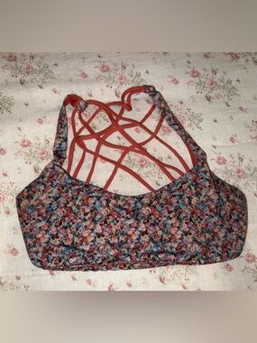 lululemon athletica floral strappy sports bra in rust and multi
